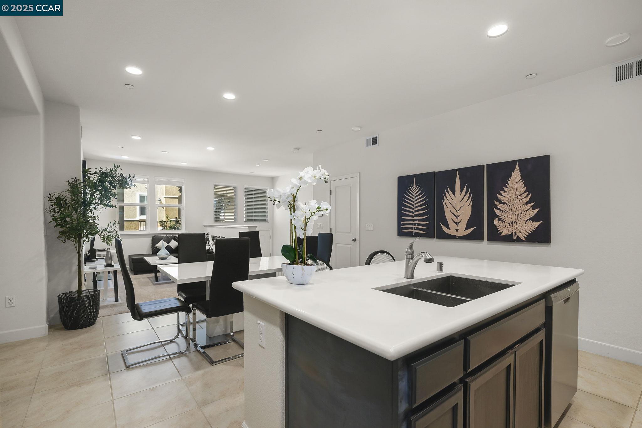 38976 Primula Terrace Newark, CA 94560 - Photo 12 of 29 a living room with furniture and a clock
