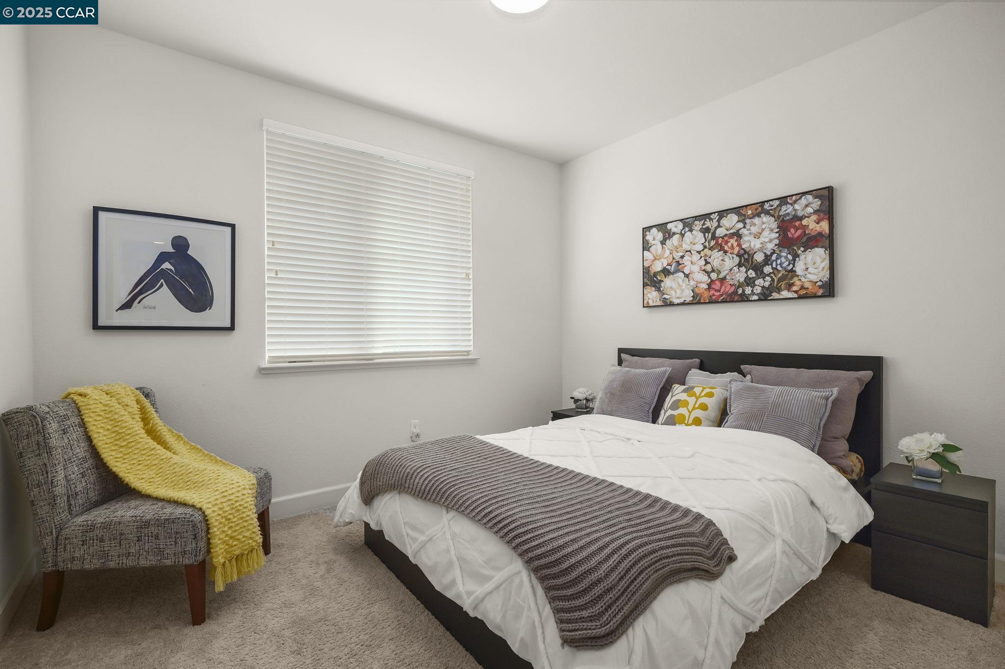 38976 Primula Terrace Newark, CA 94560 - Photo 22 of 29 a bedroom with a bed and a chair