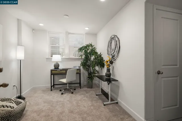 a view of a workspace with furniture