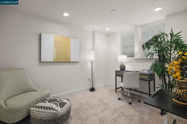 a workspace with furniture and a potted plant