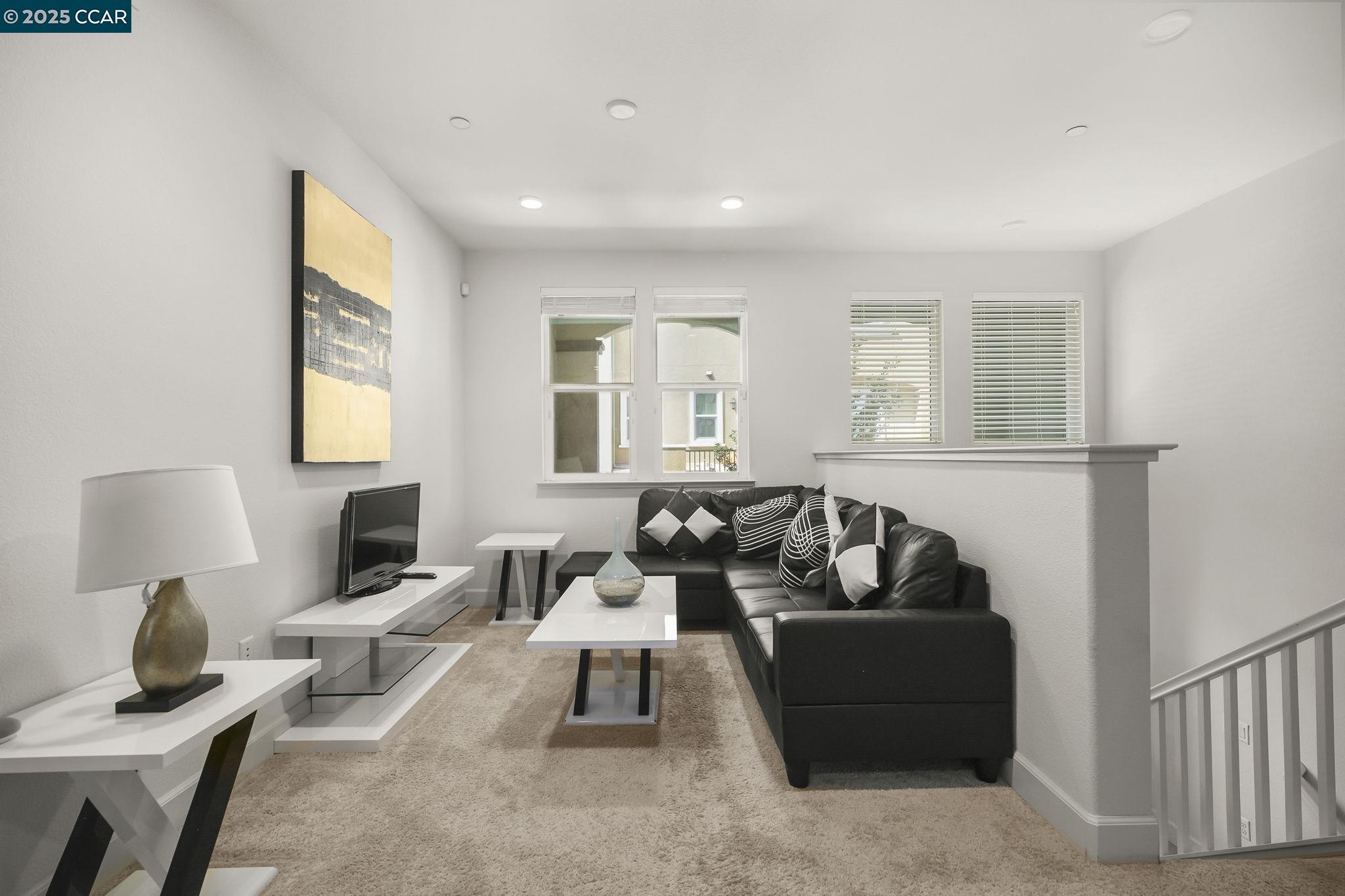 38976 Primula Terrace Newark, CA 94560 - Photo 4 of 29 a living room with furniture and a window
