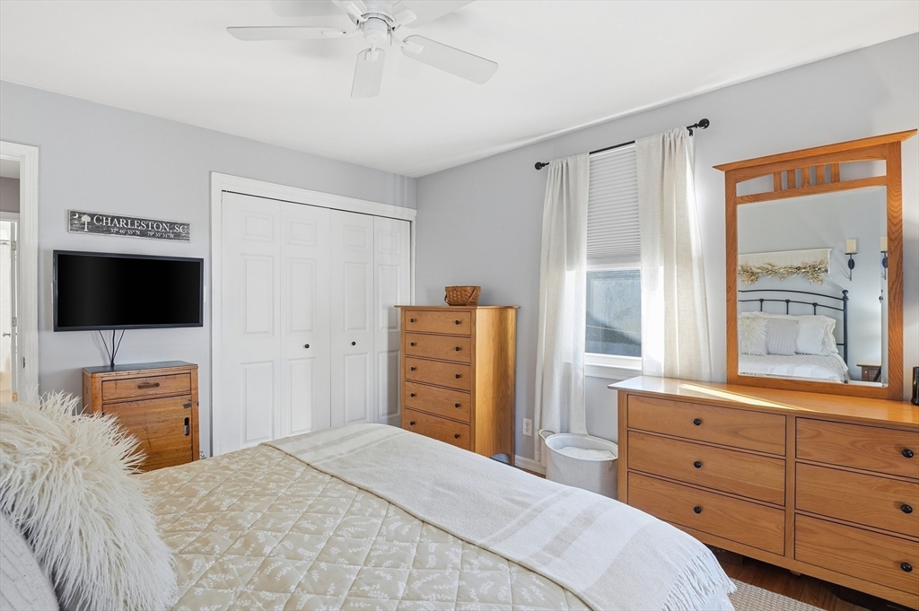 28 Sylvester Road Natick, MA 01760 - Photo 15 of 30 a bedroom with a bed and a flat screen tv