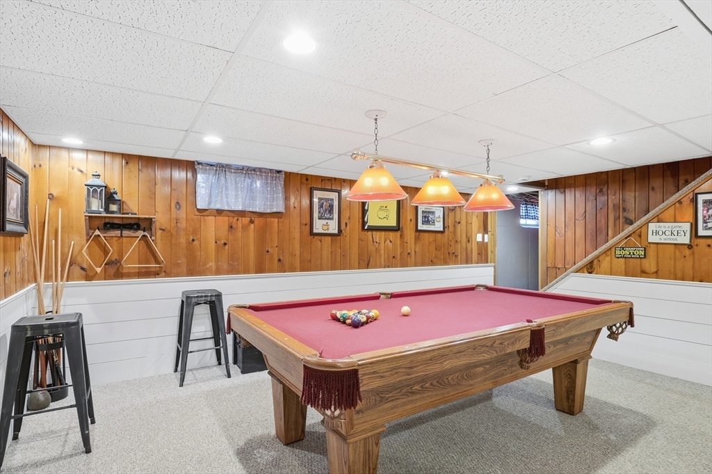 28 Sylvester Road Natick, MA 01760 - Photo 28 of 30 a kitchen with a table chairs and a room