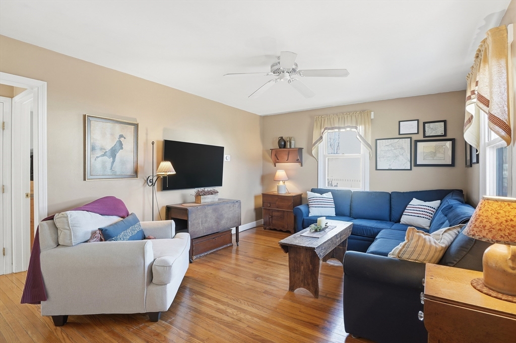 28 Sylvester Road Natick, MA 01760 - Photo 3 of 30 a living room with furniture and a flat screen tv