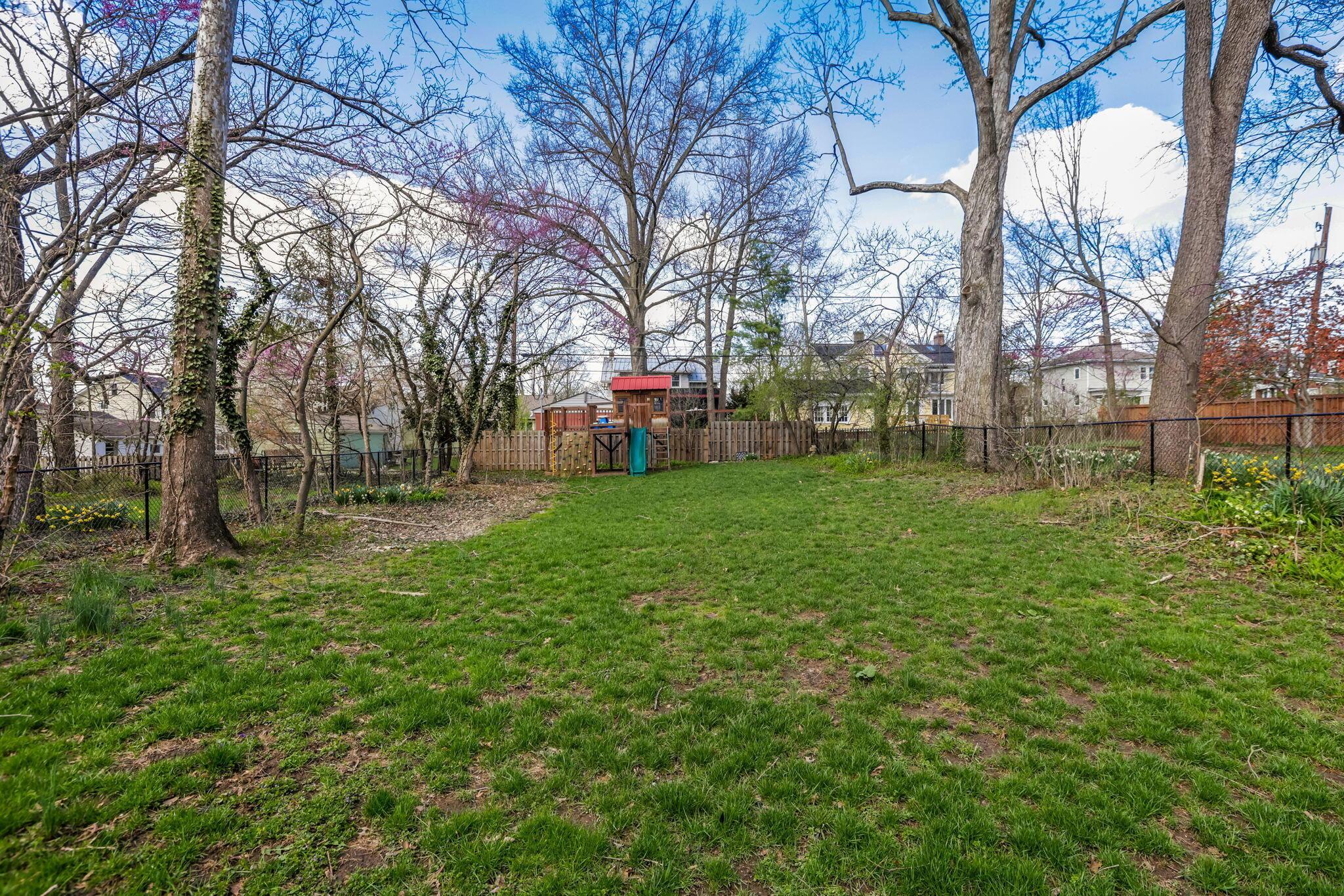 90 Brevoort Road Columbus, OH 43214 - Photo 41 of 50 large fully fenced yard with mature trees. Fence rebuilt in 2023.