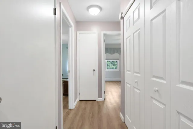 a view of a bathroom with wooden floor
