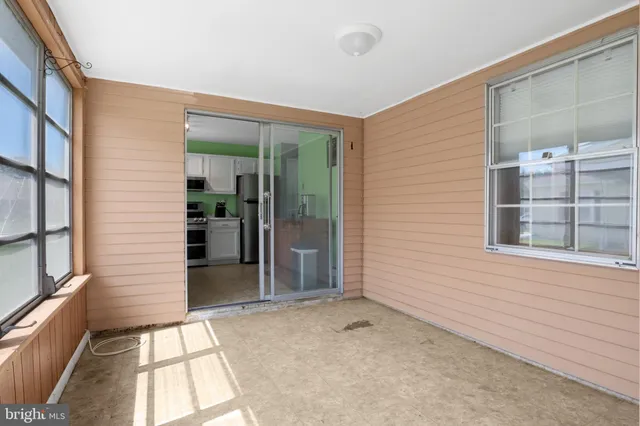 a view of a hallway with a window