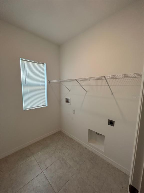5873 Beefmaster Road St. Cloud, FL 34771 - Photo 11 of 16 an empty room with white walls and white walls
