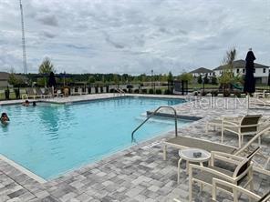 5873 Beefmaster Road St. Cloud, FL 34771 - Photo 15 of 16 a view of a lake with a terrace