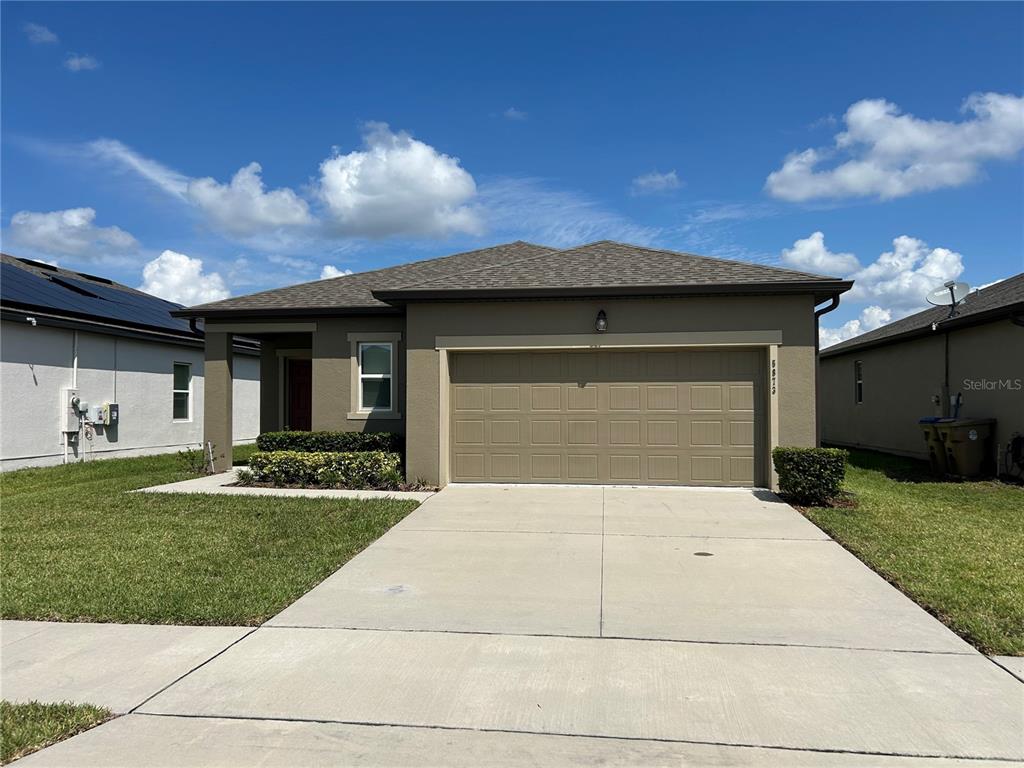 5873 Beefmaster Road St. Cloud, FL 34771 - Photo 2 of 16 a front view of house with yard