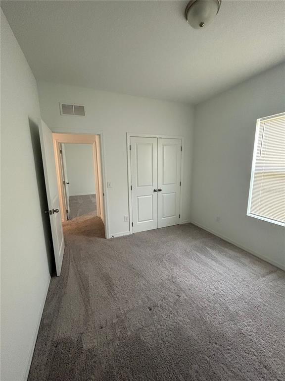 5873 Beefmaster Road St. Cloud, FL 34771 - Photo 10 of 16 a view of an empty room with a window