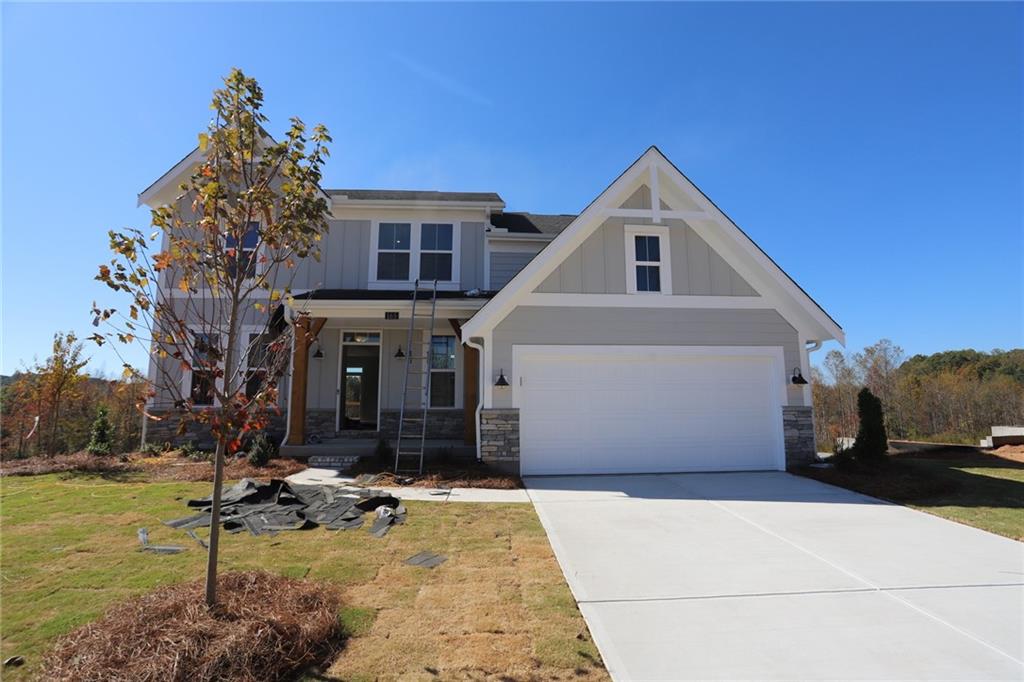 a view of a white house with a yard