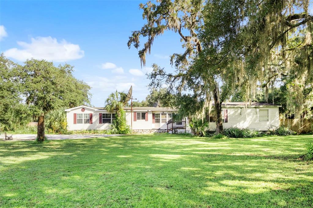 a view of a house with a big yard