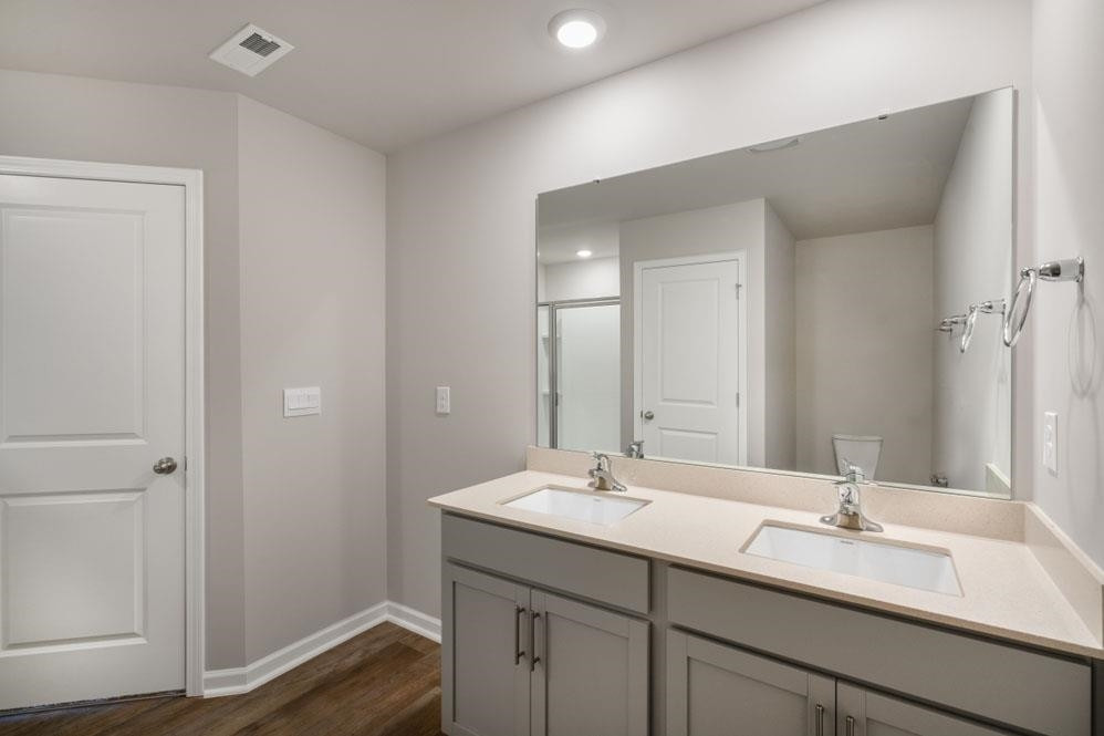 115 Starlight Street Sanford, NC 27330 - Photo 18 of 37 a bathroom with a sink and a mirror