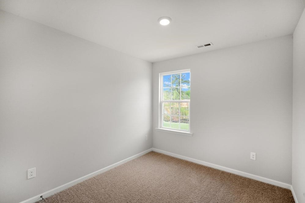115 Starlight Street Sanford, NC 27330 - Photo 27 of 37 an empty room with a window