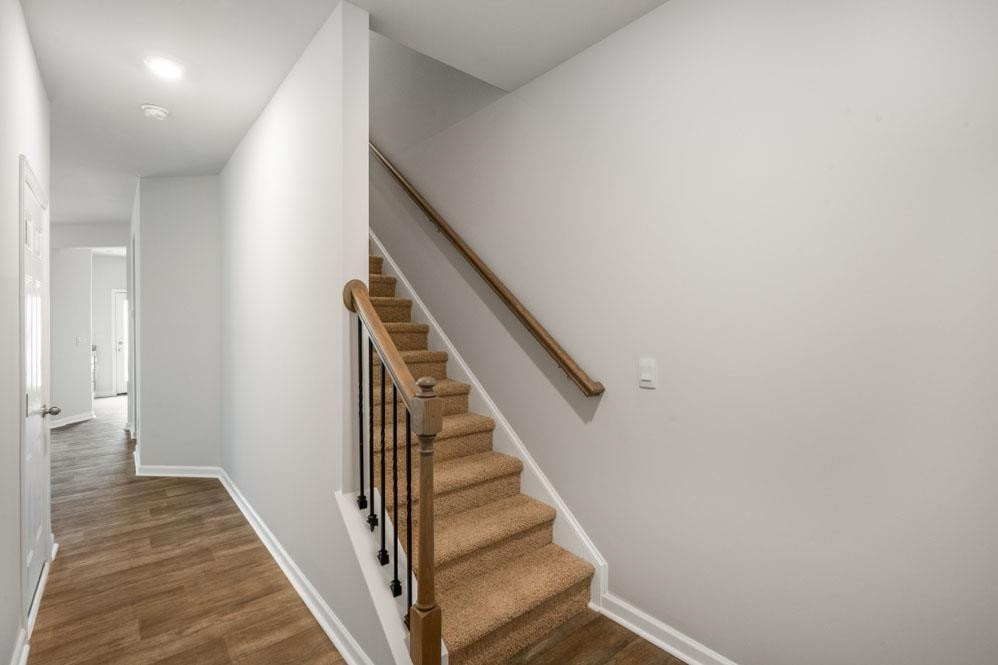 115 Starlight Street Sanford, NC 27330 - Photo 6 of 37 a view of a hallway with wooden floor and entryway