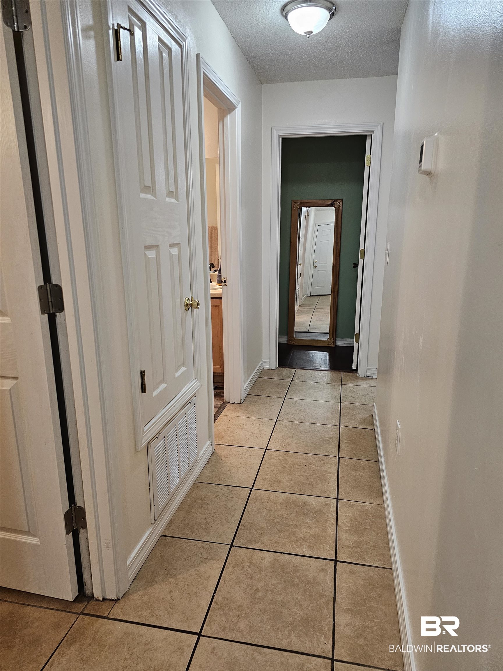 431 Hamilton Boulevard Foley, AL 36535 - Photo 25 of 30 Hallway features light tile patterned flooring.