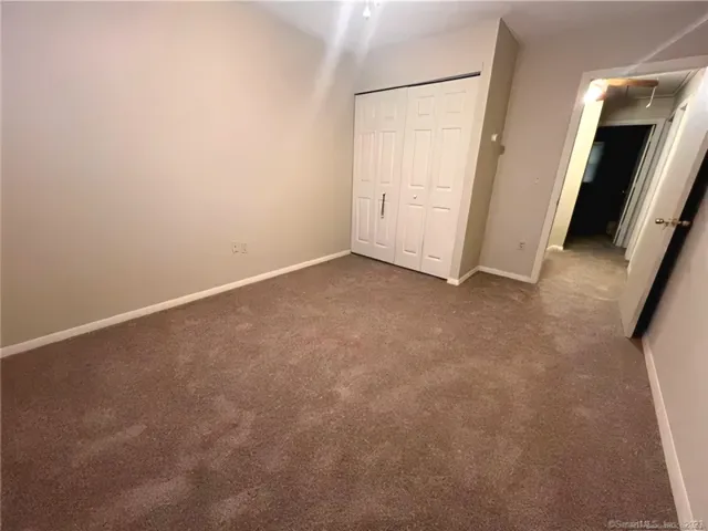 an empty room with a fireplace