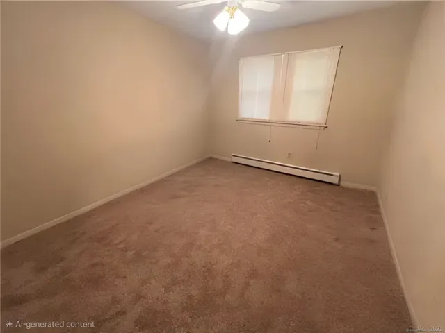 an empty room with a chandelier fan and a window