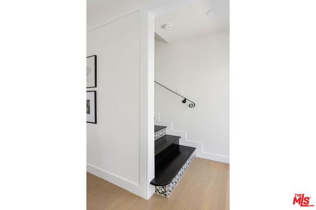 a bedroom with bed and a window