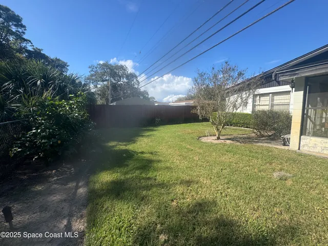 a view of a garden with a fountain