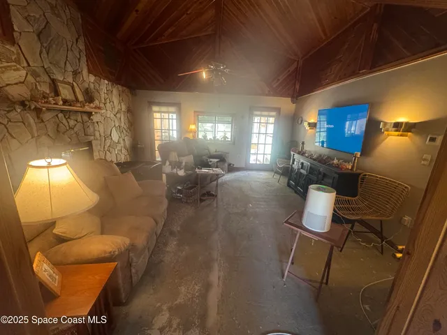a lobby with furniture and a potted plant
