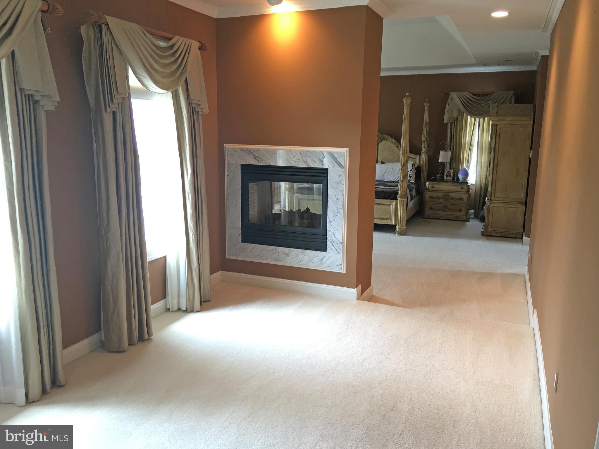 12625 Greenbriar Road Potomac, MD 20854 - Photo 9 of 19 Owner's Sitting Room with Double Sided Firpelace