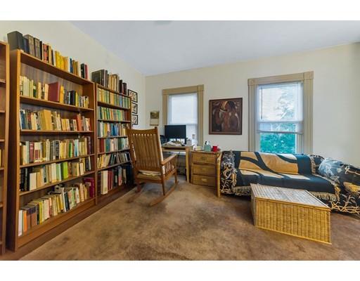 18 Washington Road Springfield, MA 01108 - Photo 13 of 22 a living room with furniture and a book shelf