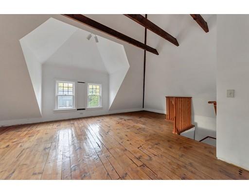 18 Washington Road Springfield, MA 01108 - Photo 18 of 22 a view of an empty room with wooden floor and a window