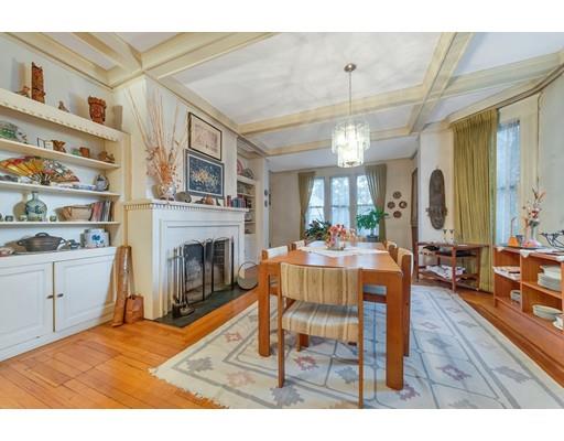 18 Washington Road Springfield, MA 01108 - Photo 6 of 22 a dining room with furniture a fireplace and wooden floor