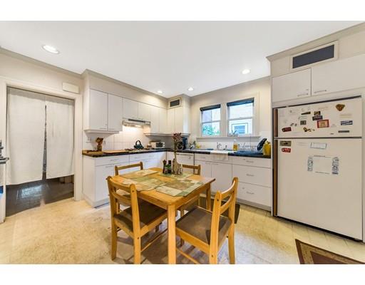 18 Washington Road Springfield, MA 01108 - Photo 9 of 22 a kitchen with stainless steel appliances granite countertop a dining table chairs refrigerator and sink