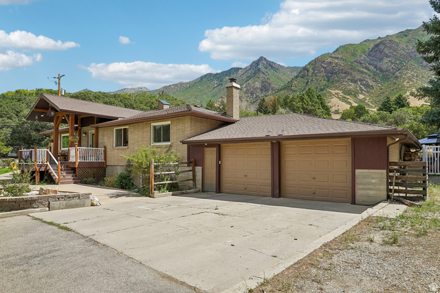 400 High Bench Road Alpine, UT 84004 - Photo 26 of 34 Brick exterior with a covered porch featuring wood support beams