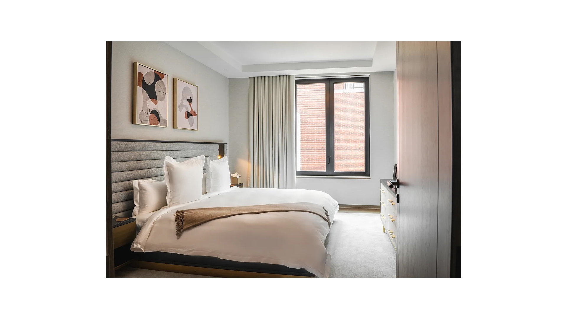 401 West Street, Unit 5A Manhattan, NY 10014 - Photo 10 of 11 a room with a bed and a painting on the wall