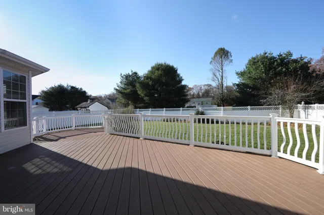 a view of a balcony with wooden floor