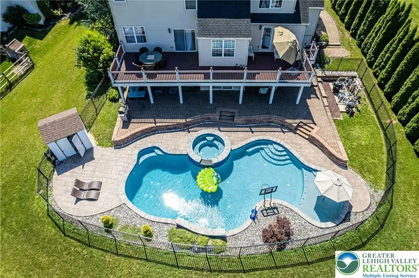 an aerial view of a house with a garden