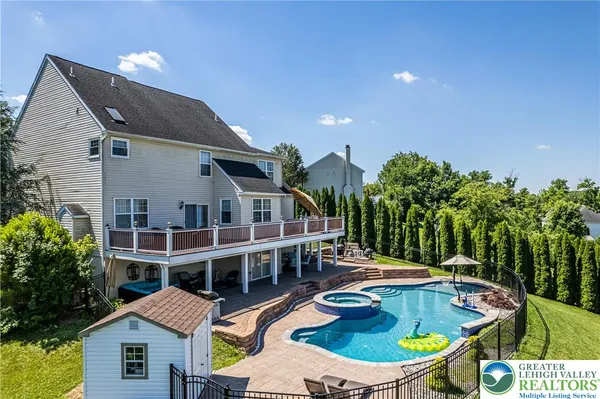 a view of a livingroom with furniture wooden floor and chandelier