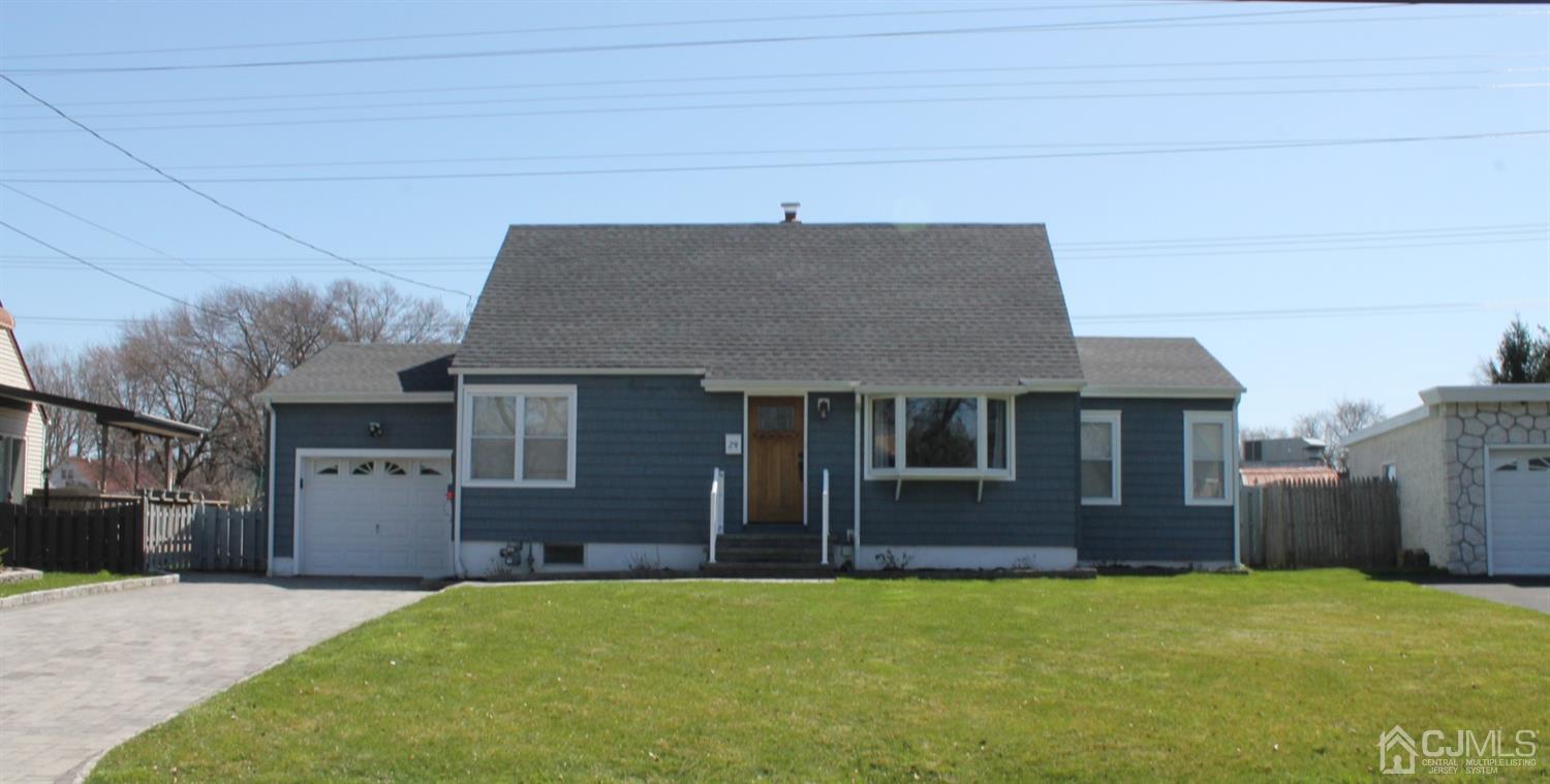 29 Longfield Road New Brunswick, NJ 08901 - Photo 1 of 25 a front view of a house with a yard
