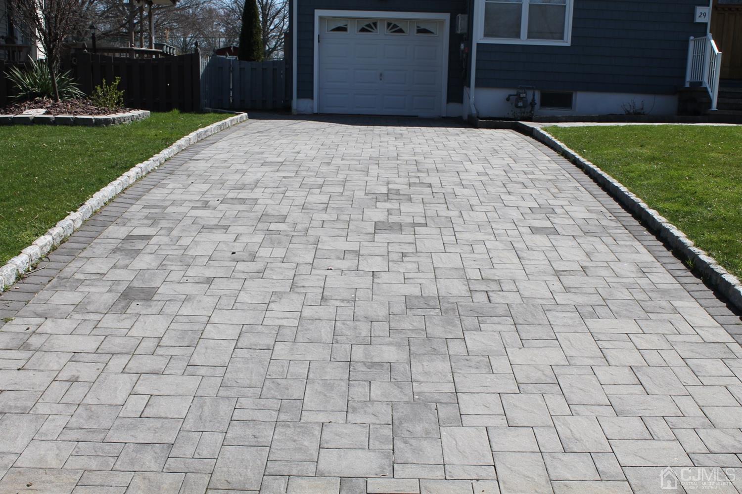 29 Longfield Road New Brunswick, NJ 08901 - Photo 2 of 25 a brick building with a yard