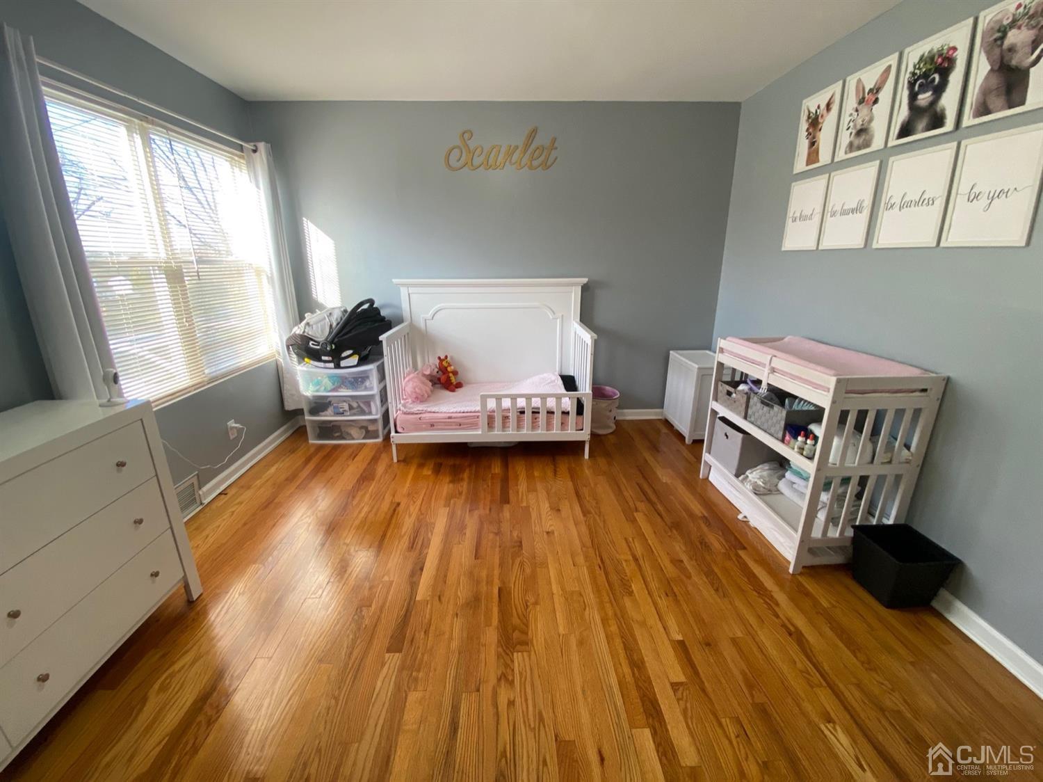 29 Longfield Road New Brunswick, NJ 08901 - Photo 14 of 25 a bedroom with a bed and a window
