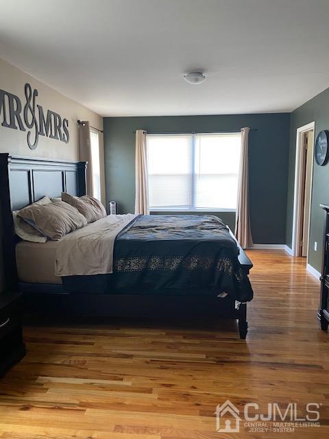 29 Longfield Road New Brunswick, NJ 08901 - Photo 15 of 25 a bedroom with a bed and a window
