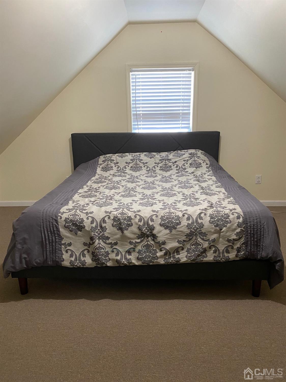 29 Longfield Road New Brunswick, NJ 08901 - Photo 19 of 25 a bed sitting in a bedroom next to a window