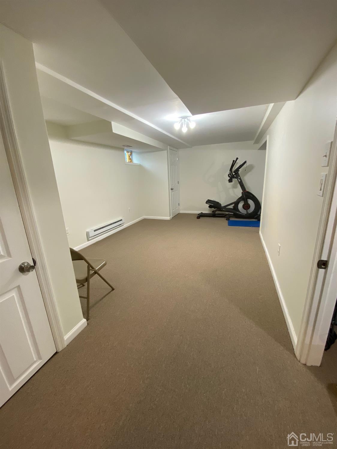 29 Longfield Road New Brunswick, NJ 08901 - Photo 22 of 25 a view of a livingroom with wooden floor and white walls
