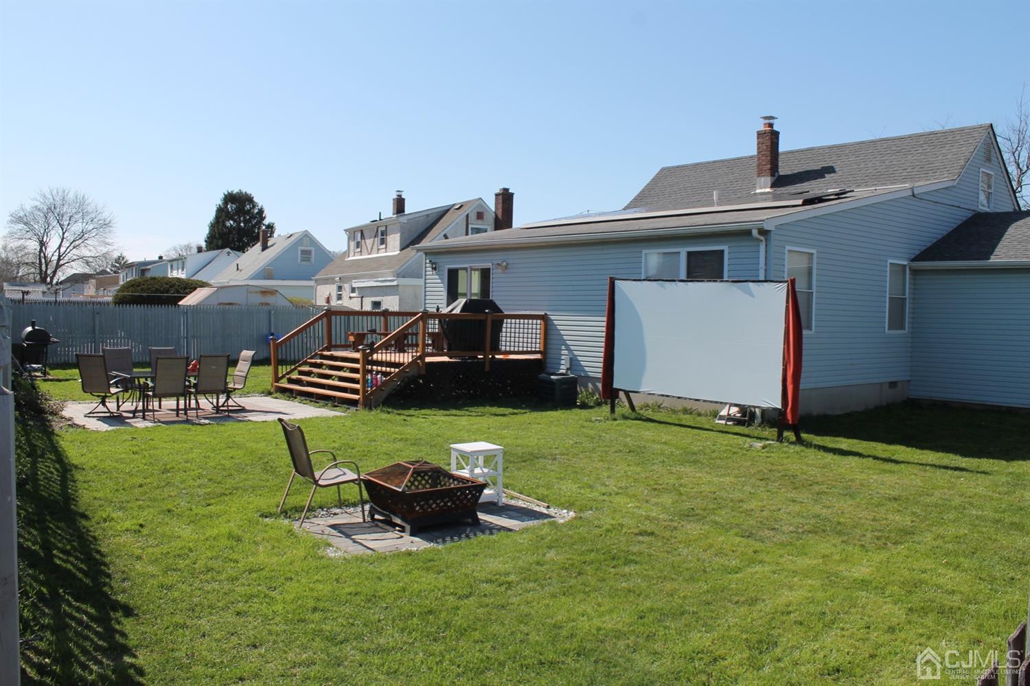29 Longfield Road New Brunswick, NJ 08901 - Photo 4 of 25 a view of a house with backyard sitting area and garden