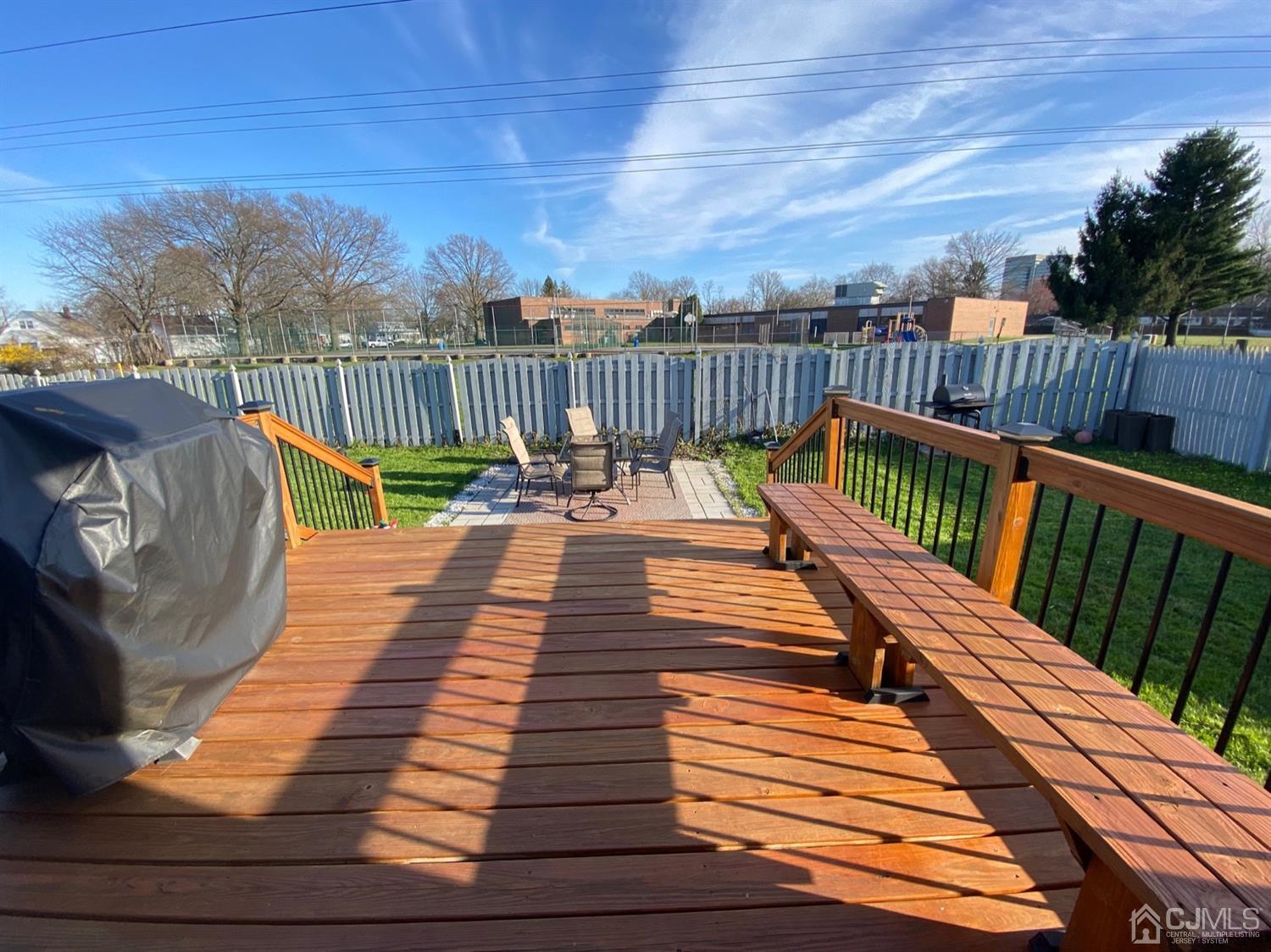 29 Longfield Road New Brunswick, NJ 08901 - Photo 5 of 25 a view of deck with wooden floor and outdoor seating