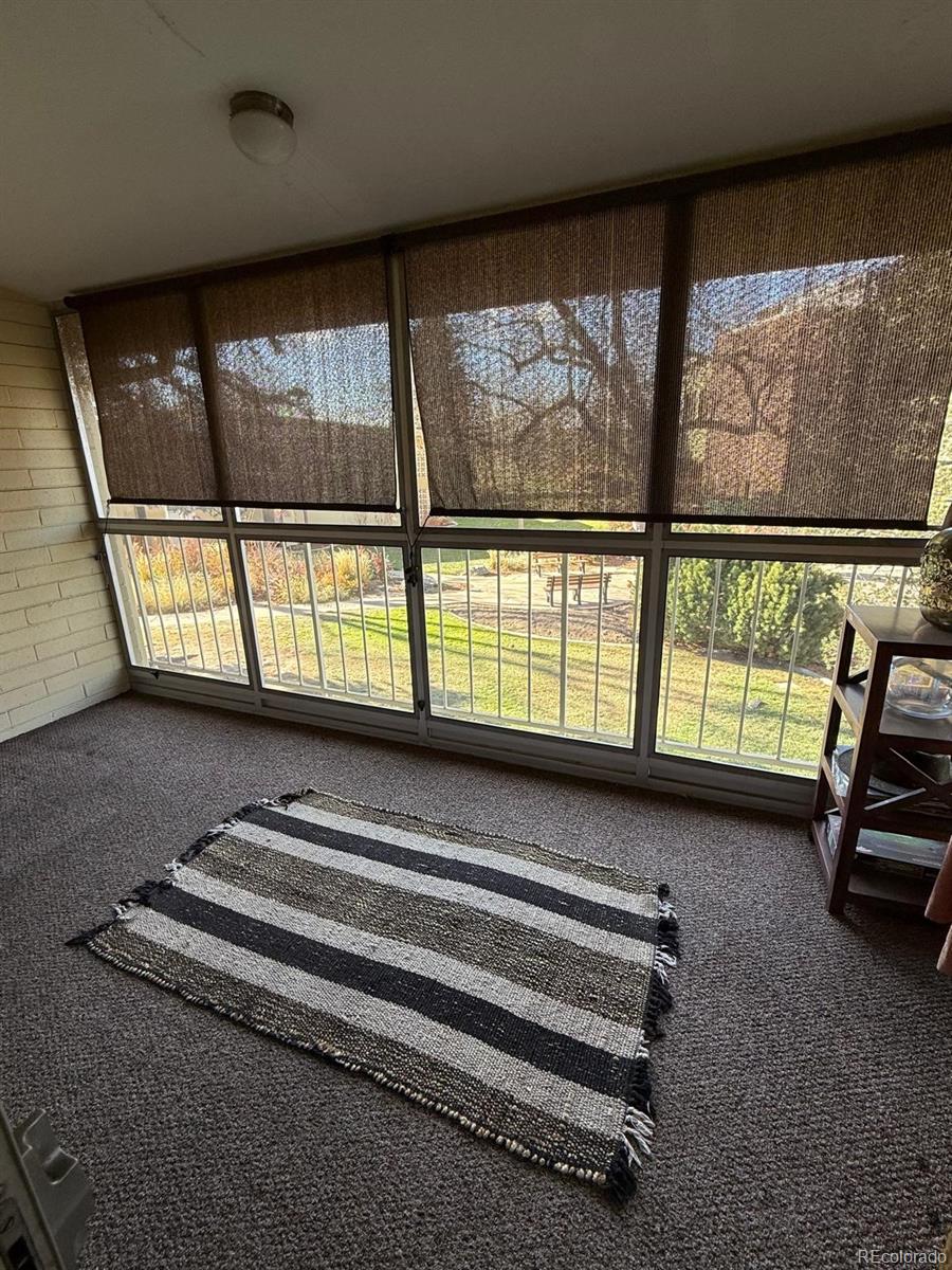615 South Clinton Street, Unit 9B Denver, CO 80247 - Photo 14 of 24 a view of staircase with a rug and a large window