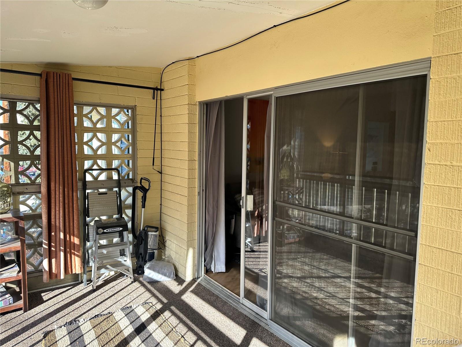 615 South Clinton Street, Unit 9B Denver, CO 80247 - Photo 15 of 24 a bathroom with a glass door shower and furniture