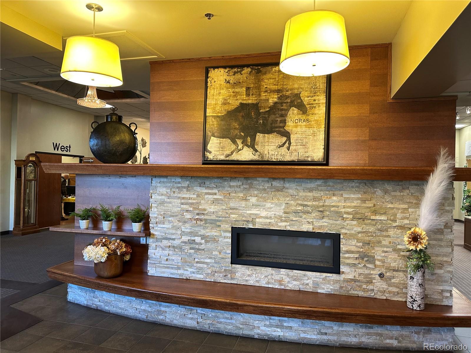 615 South Clinton Street, Unit 9B Denver, CO 80247 - Photo 17 of 24 a kitchen with a sink and chandelier