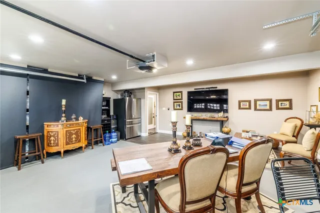a bedroom with furniture and a flat screen tv