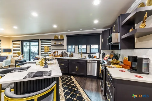 an aerial view of a house with garden space and sitting space