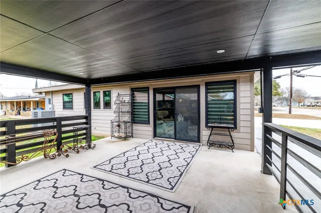 a bathroom with a sink toilet a mirror and shower